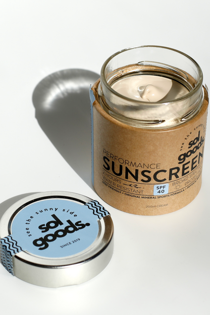 Solu Goods performance sunscreen jar with a silver lid on a white background